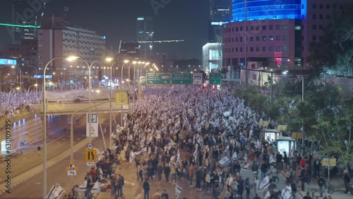 Thousands of people wave Israeli flags during demonstrations photo