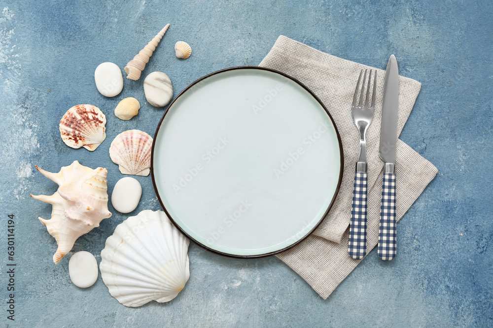 Beautiful table setting with marine decor on blue background Beautiful table setting with marine decor on blue background