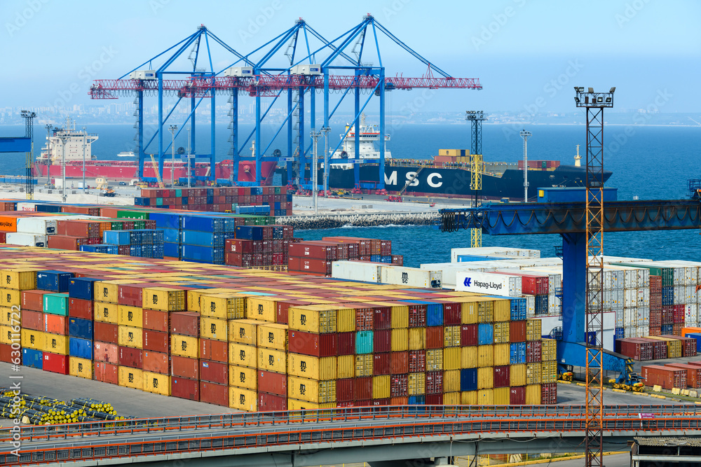view of the commercial industrial seaport, infrastructure, warehouses with containers, loading