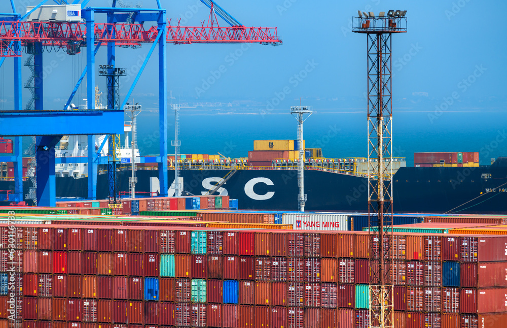 view of the commercial industrial seaport, infrastructure, warehouses with containers, loading