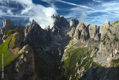 Beautiful mountain panorama of peaks in the Dolomites, Italy, Cadini Group. Beautiful mountain peaks with blue sky and clouds. 