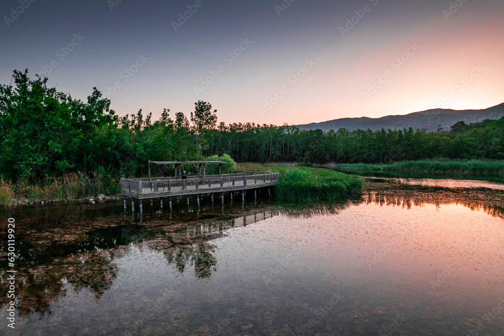 Fototapeta premium The beautiful landscapes of Kovada Lake, mountains and green area from the air. Isparta Lake District, TURKEY