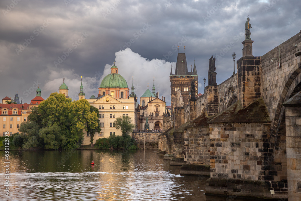 Charles Bridge in the evening with clouds - just after a storm and rain Charles Bridge in the evening with clouds - just after a storm and rain