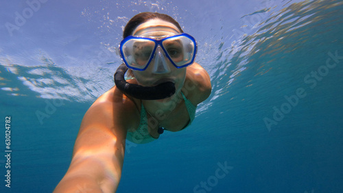 UNDERWATER: Adventurous woman dives into crystal clear water of Adriatic Sea