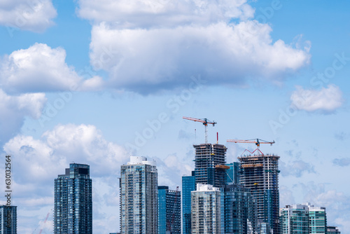 Photography tall building construction site with active cranes