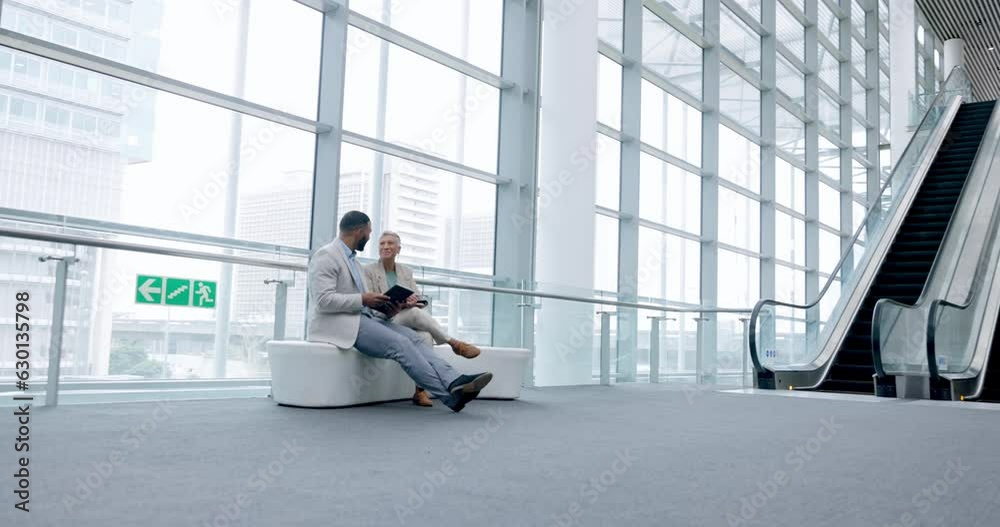 Tablet, teamwork and planning with business people at airport for networking, communication and idea. Technology, meeting and travel with man and woman in lobby for schedule, digital and app