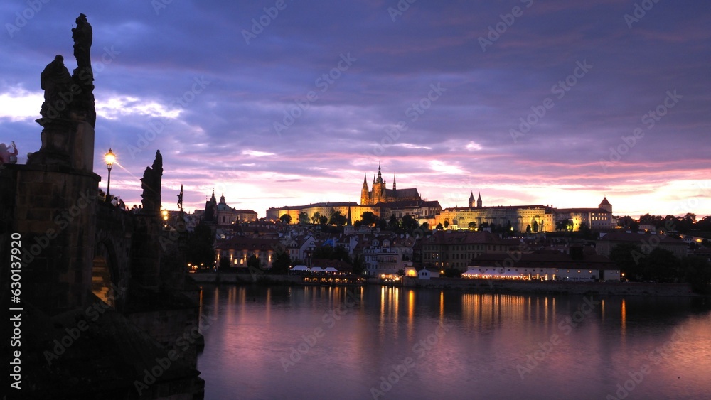 prague skyline and bridge over river in czech republic - palace, castle cathedral, sculpture on the bridge