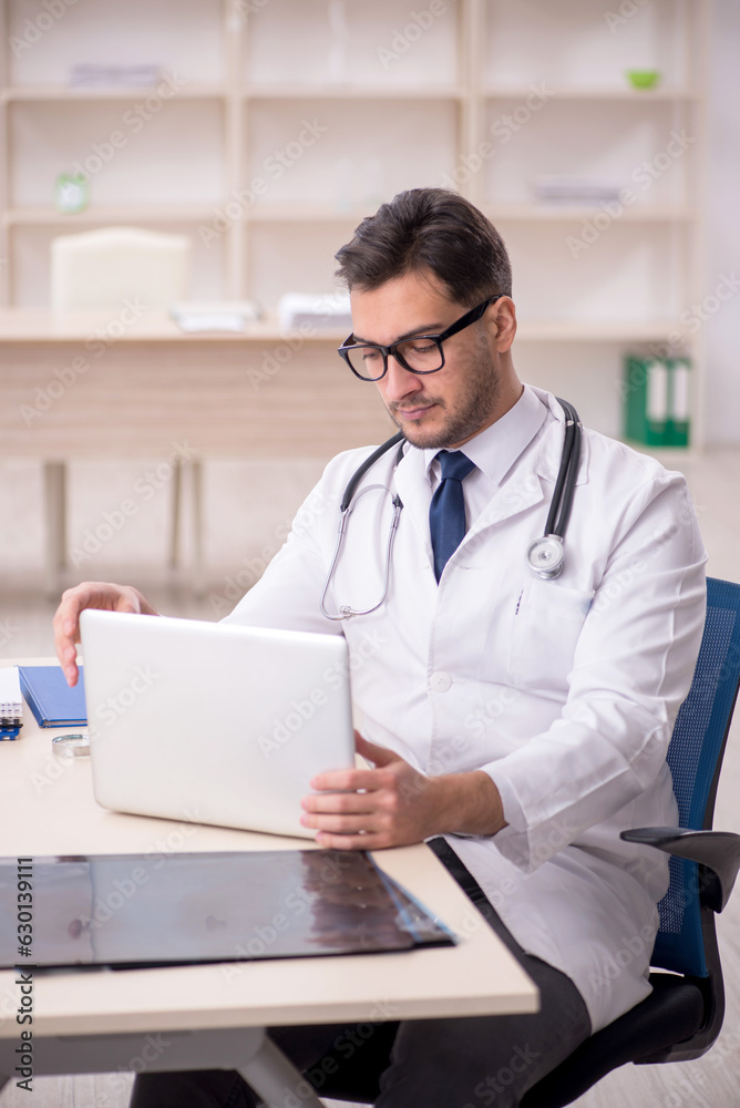 Young male doctor in telemedicine concept Young male doctor in telemedicine concept