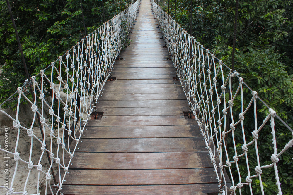 Fototapeta premium Point of view wooden hanging bridge