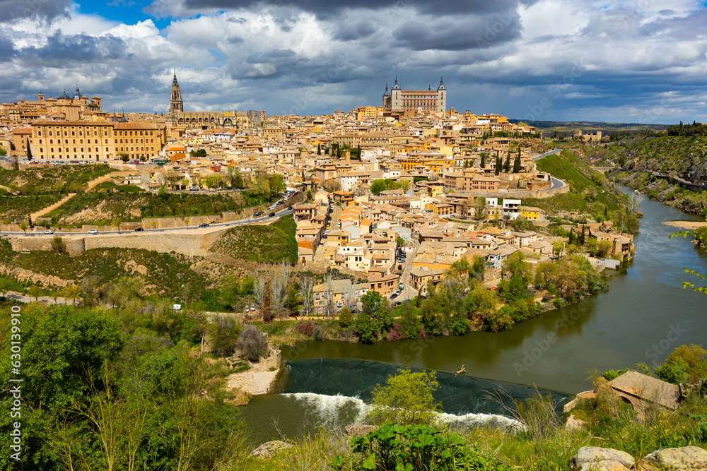 Picturesque view of medieval houses of Spanish town of Toledo and Tagus river