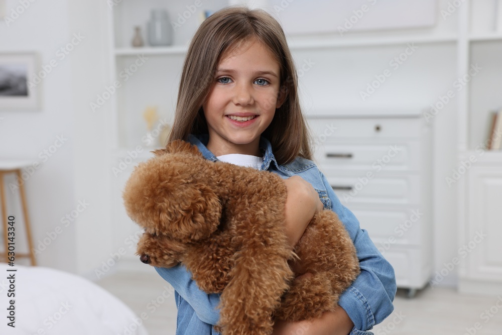 Little child with cute puppy at home. Lovely pet Little child with cute puppy at home. Lovely pet