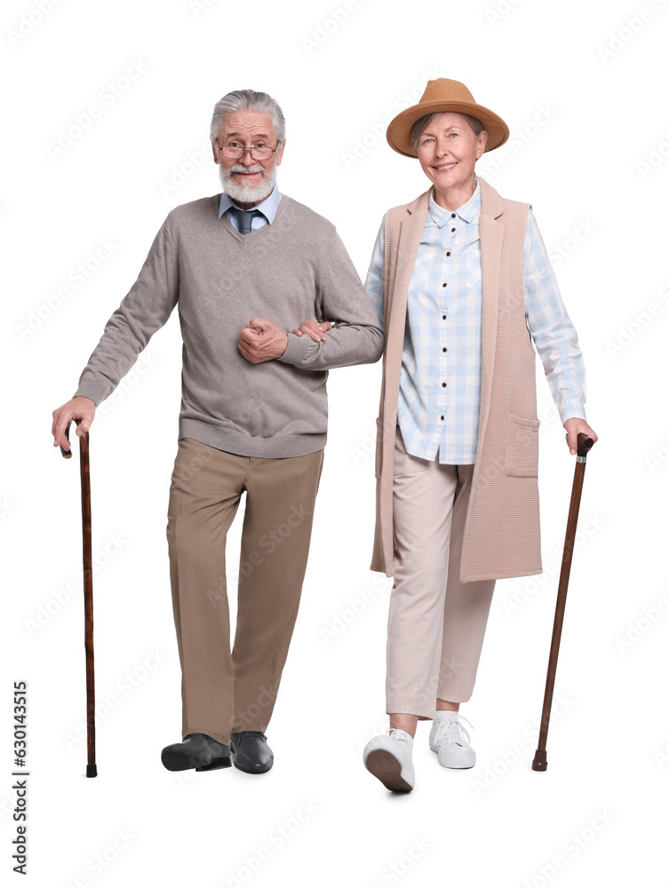 Senior man and woman with walking canes on white background Senior man and woman with walking canes on white background