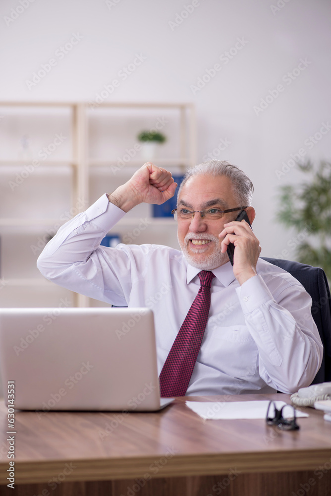 Old male employee and too much work in the office Old male employee and too much work in the office