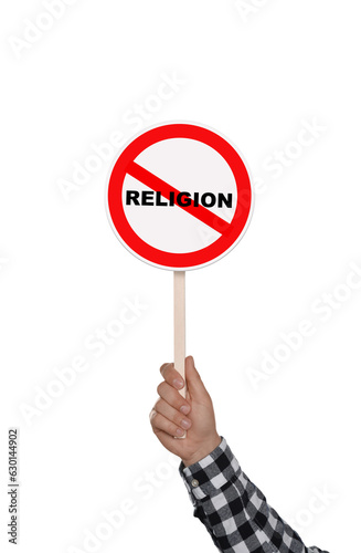 Atheism concept. Man holding prohibition sign with crossed out word Religion on white background