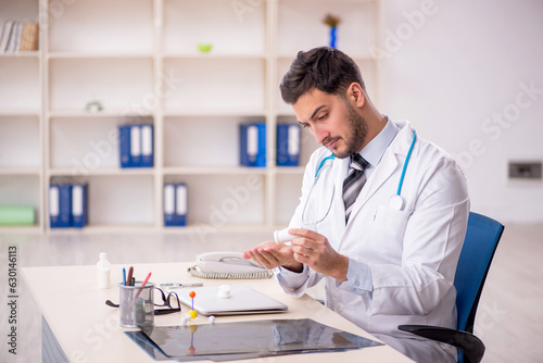 Young male doctor working at the hospital