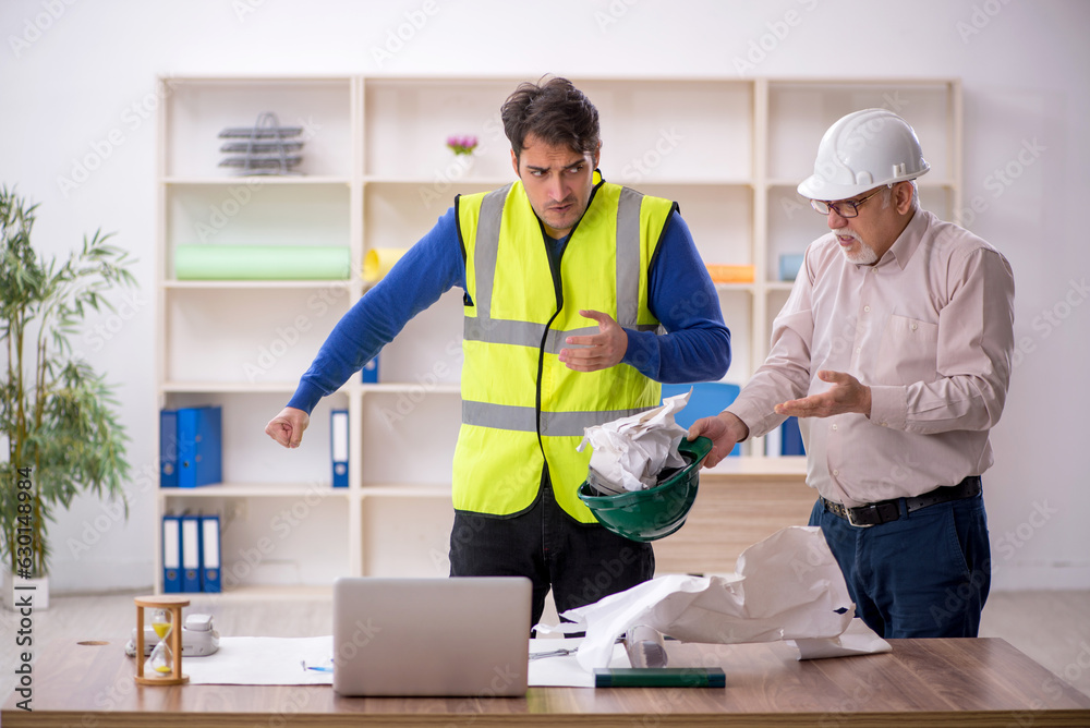 Fototapeta premium Two male architects working on the project