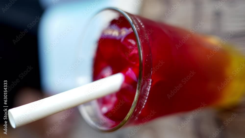 Red bubble tea in a glass with ice Red bubble tea in a glass with ice