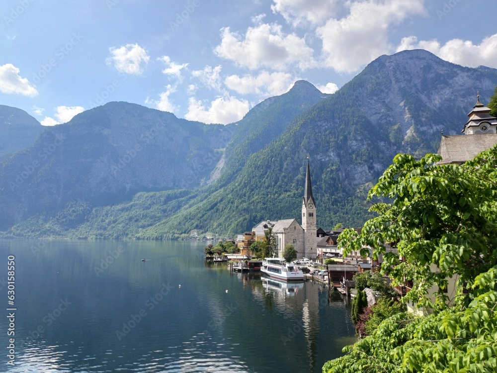 Scenic picture view of famous Hallstatt mountain village with Hallstatt Lake in the Austrian Alps, region of Salzkammergut, Austria. Scenic picture view of famous Hallstatt mountain village with Hallstatt Lake in the Austrian Alps, region of Salzkammergut, Austria.