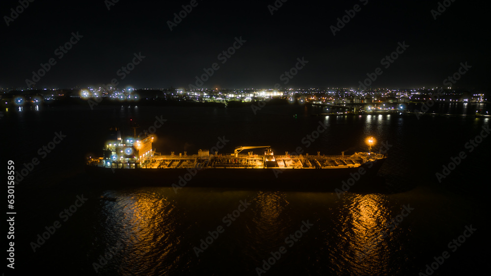 Night aerial view of a cargo ship moored in the Port of Paranaguá, Paraná, Brazil.
