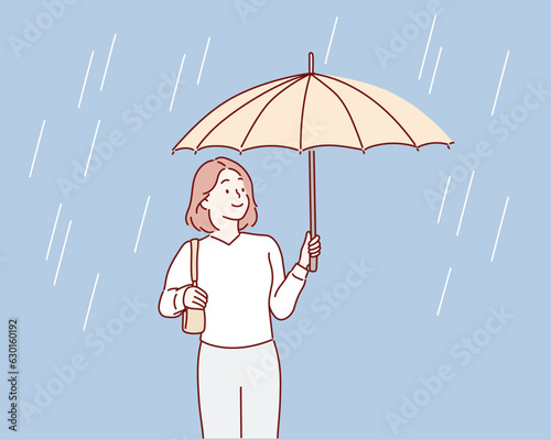 Smiling girl with umbrella posing under the rain. Hand drawn style vector design illustrations.