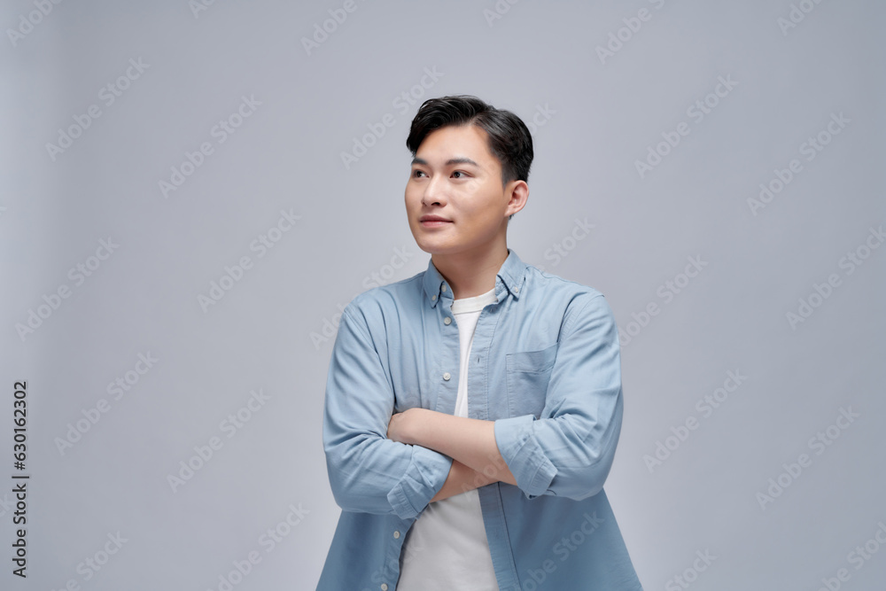 Asian businessman was crossing his arms and smiling confidently Asian businessman was crossing his arms and smiling confidently