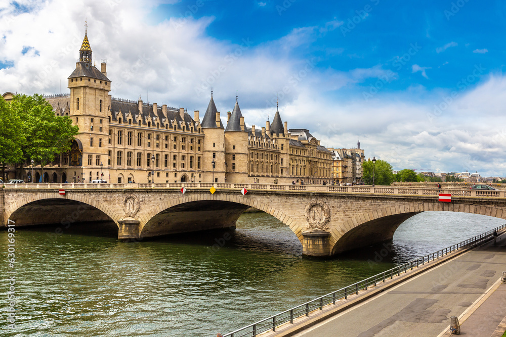 Pont au Change bridge over Seine river and Conciergerie palace and prison in Paris, France