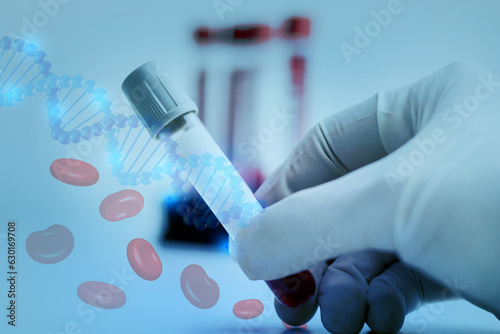 Doctor hand holding Test Tube (vacutainer) with red Blood for testing in Hematology laboratory at Hospita.