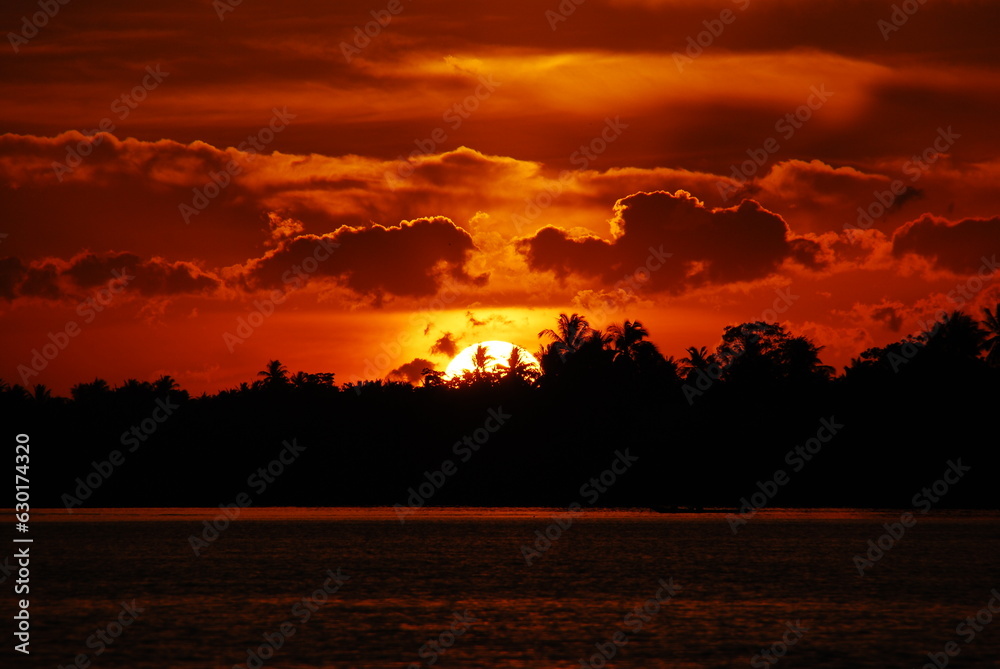 Obraz premium Scenic view dramatic beautiful sunset sky. Natural Sunset Sunrise on meadow silhouette shadow dark land. Vibrant dramatic sky on sunset, dawn, sunrise in Countryside. Landscape Colorful Sky At Sunset