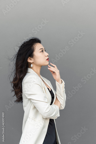 portrait of a confident businesswoman with gray background. 