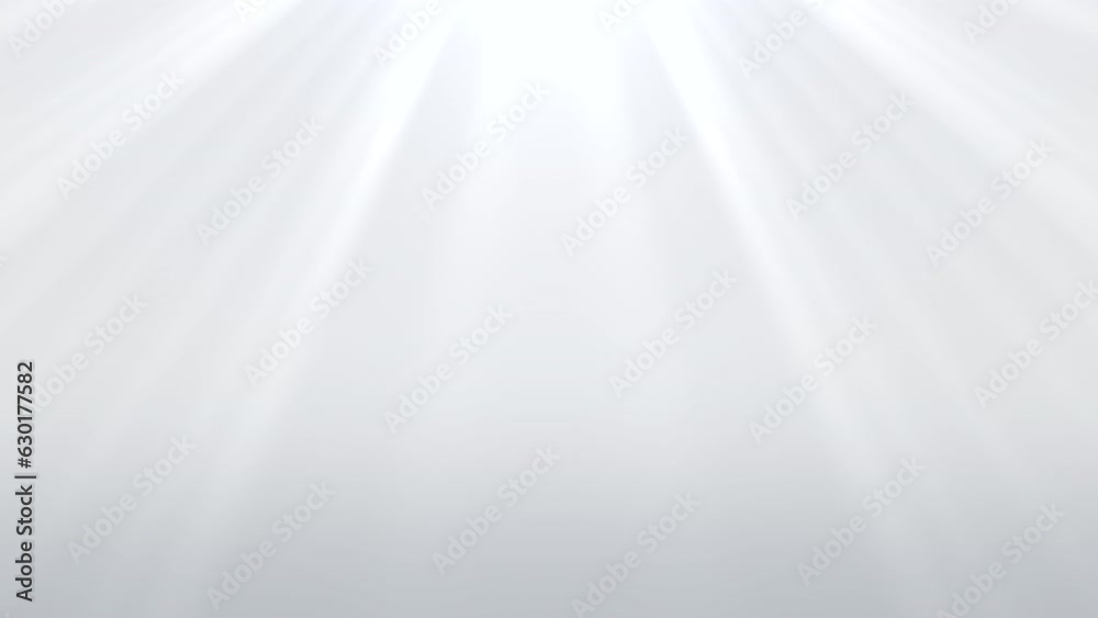 White light streams onto a pristine white backdrop from different angles, illuminating the scene in a captivating manner. The rays are diffused, spreading across the frame