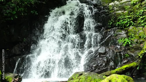 A tropical waterfall in the jungles. Slow motion. Malisbog Falls. Negros, Philippines. photo