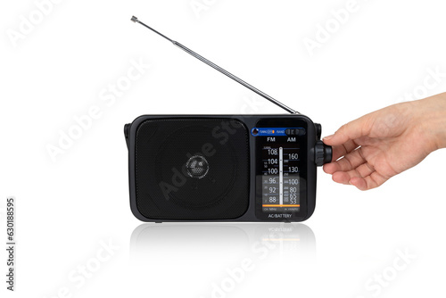 Radio receiver on a white background. Black portable wireless radio close-up isolated on a white background.