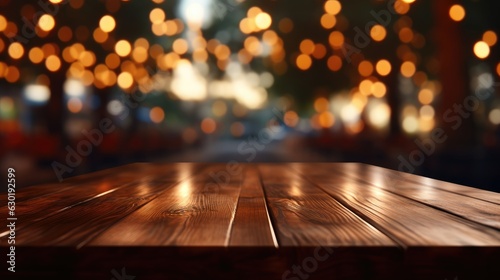 Empty brown wooden tables and bokeh lights blurred outdoor cafe abstract background of restaurant lighting where people enjoy eating can be used for montages or to display your products.