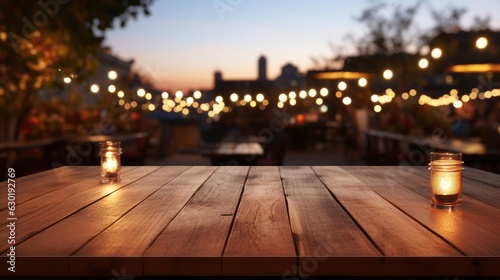 Empty brown wooden tables and bokeh lights blurred outdoor cafe  abstract background of restaurant lighting where people enjoy eating can be used for montages or to display your products.