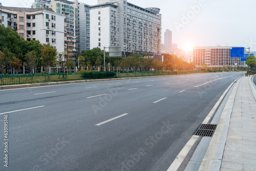 Empty urban road and buildings in the city © gjp311
