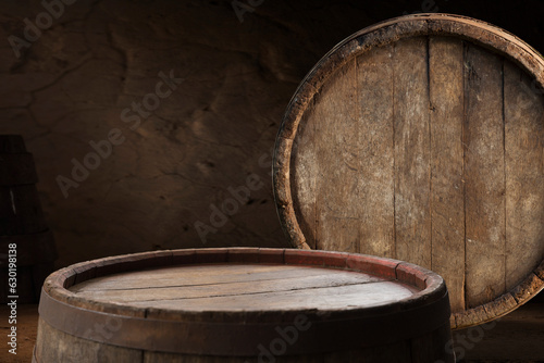 Beer barrel with beer glasses on table on wooden background