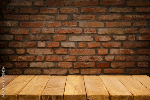 Selected focus empty brown wooden table and wall texture or old black brick wall blur background image. for your photomontage or product display. High quality photo