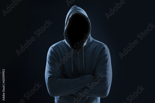 Bild auf Leinwand Anonymous man in hood on black background