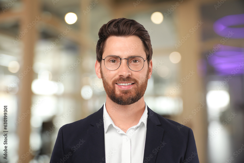 Handsome confident man with eyeglasses in office Handsome confident man with eyeglasses in office