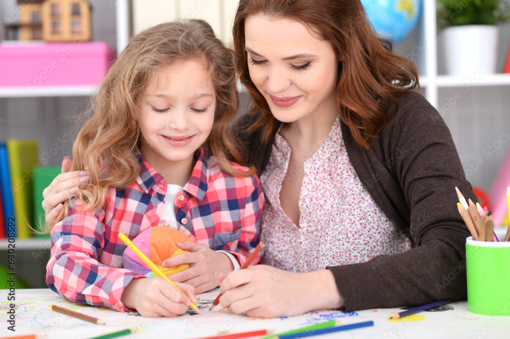 little cute girl with mother drawing little cute girl with mother drawing