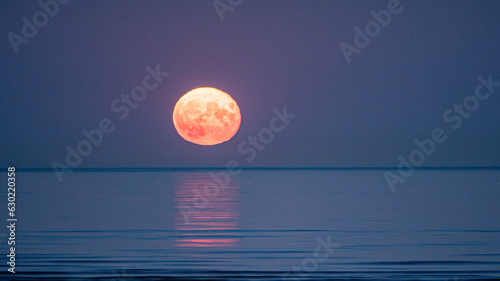Photography Super moon full moon rising above the sea with reflection