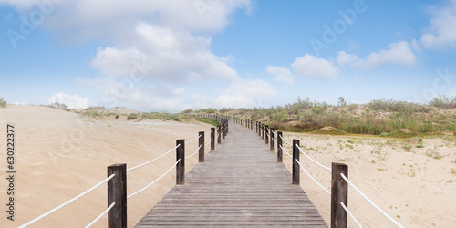 Panoramic view of wooden walkway with dunes in Ebro Delta  Spain