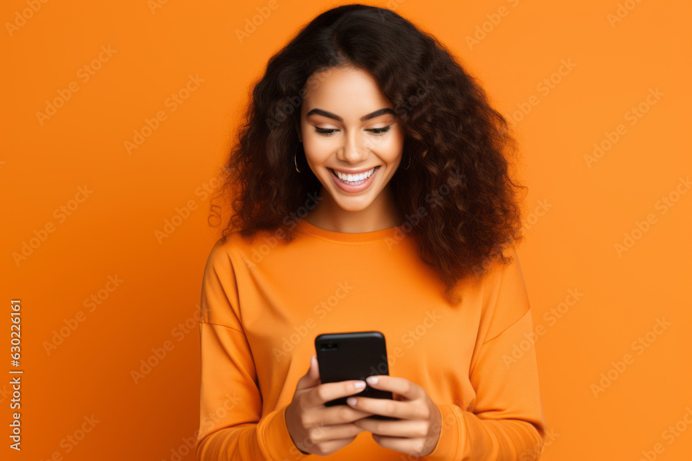 woman and man with phone on orange background. woman and man with phone on orange background.