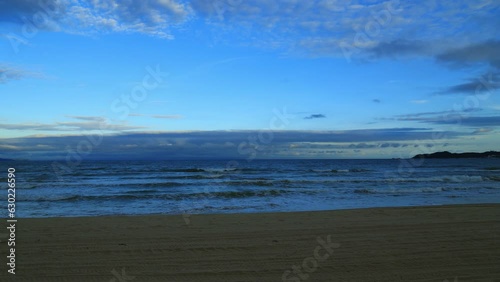 Haitang bay time lapse at dusk by the sea. Haitang Bay, located in Sanya, Hainan Province, is a famous resort bay in China. photo