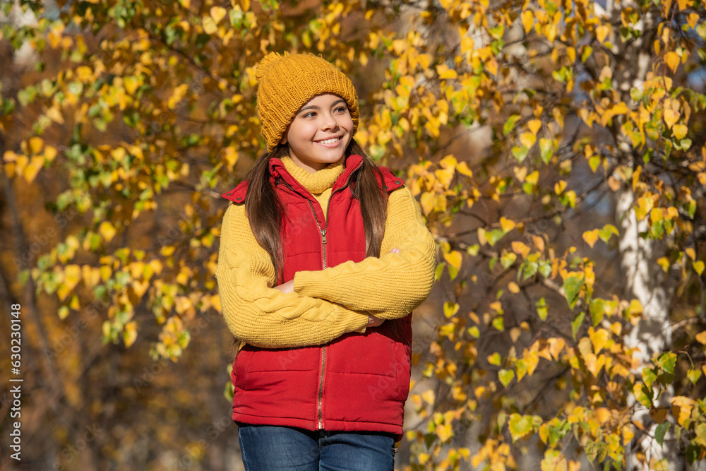 glad teen schoolgirl at school time outdoor in autumn season