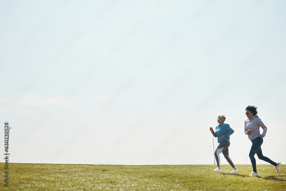 Women are running, fitness and cardio outdoor with training for marathon with mockup space. Female runner team in park, exercise and triathlon race with sports and athlete, health and wellness