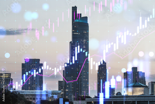 Creative glowing candlestick forex chart on blurry city buildings wallpaper. Technology  trade and financial data concept. Double exposure.