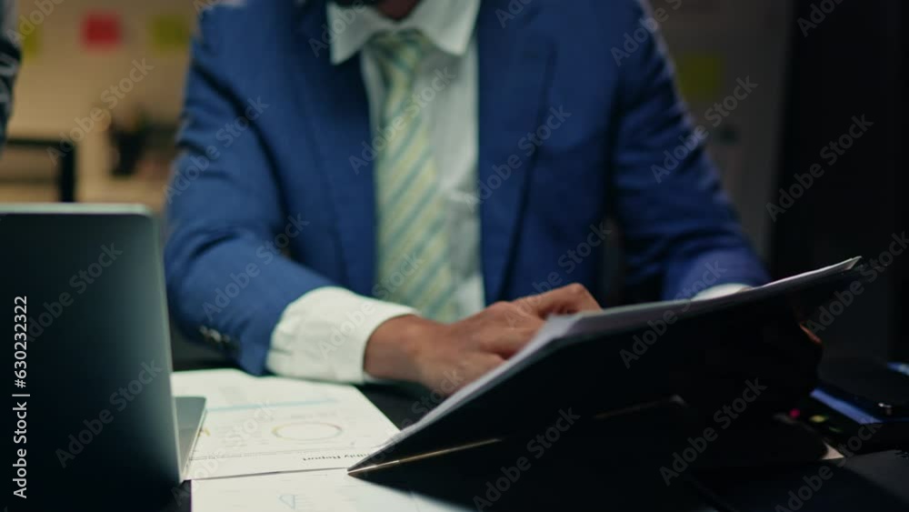 Close up of businessman hands are working overtime calculate and brainstorming about business financial and marketing. Close up of businessman hands are working overtime calculate and brainstorming about business financial and marketing.