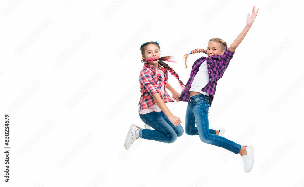 girls friends having fun and jumping. friendship of two children. happy girls sisterhood. children have fun together. bond of sisterhood and friendship. Sisters by heart. copy space girls friends having fun and jumping. friendship of two children. happy girls sisterhood. children have fun together. bond of sisterhood and friendship. Sisters by heart. copy space