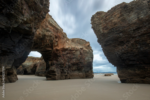 Playa de las Catedrales, Lugo, Galicia, Spain, on a cloudy day at sunrise